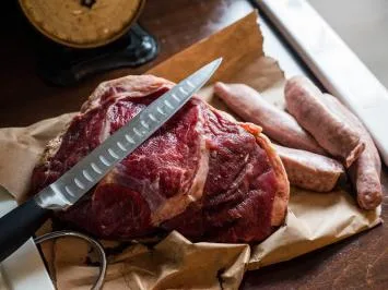 Fresh roast and sausages on butcher paper