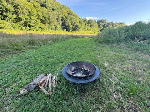Campfire ring at dusk on the farm