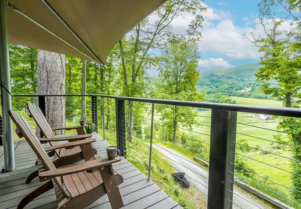 Adirondack chairs on back porch overlooking mountain valley