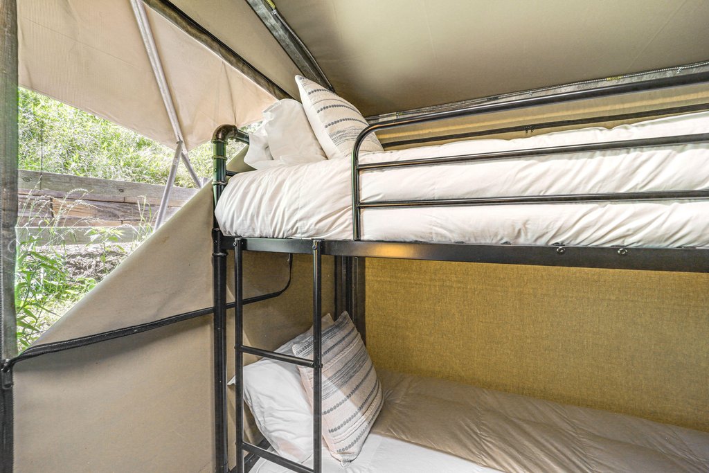 Twin bunk beds inside the glamping tent