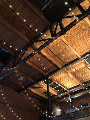 String lights hung up in the ceiling of Bay 7