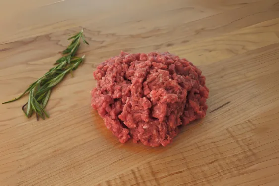 Proper Meats Ground Beef, a one pound pack, raw and coarsely ground