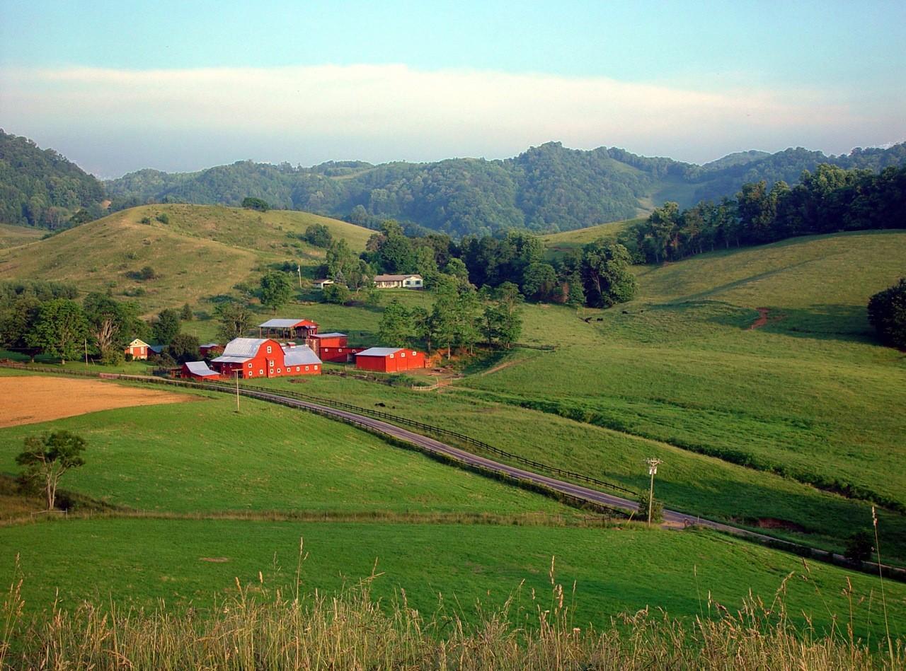 Red barns and rolling pasture at historic Shipley Farms seen from the overlook