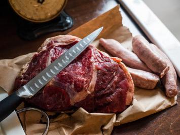 Fresh roast and sausages on butcher paper